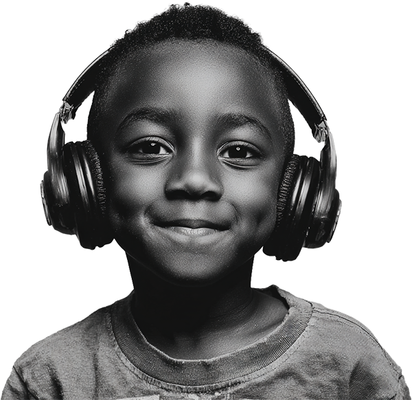 Young boy smiling wearing headphones