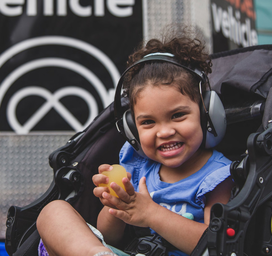 Smiling toddler with headphones